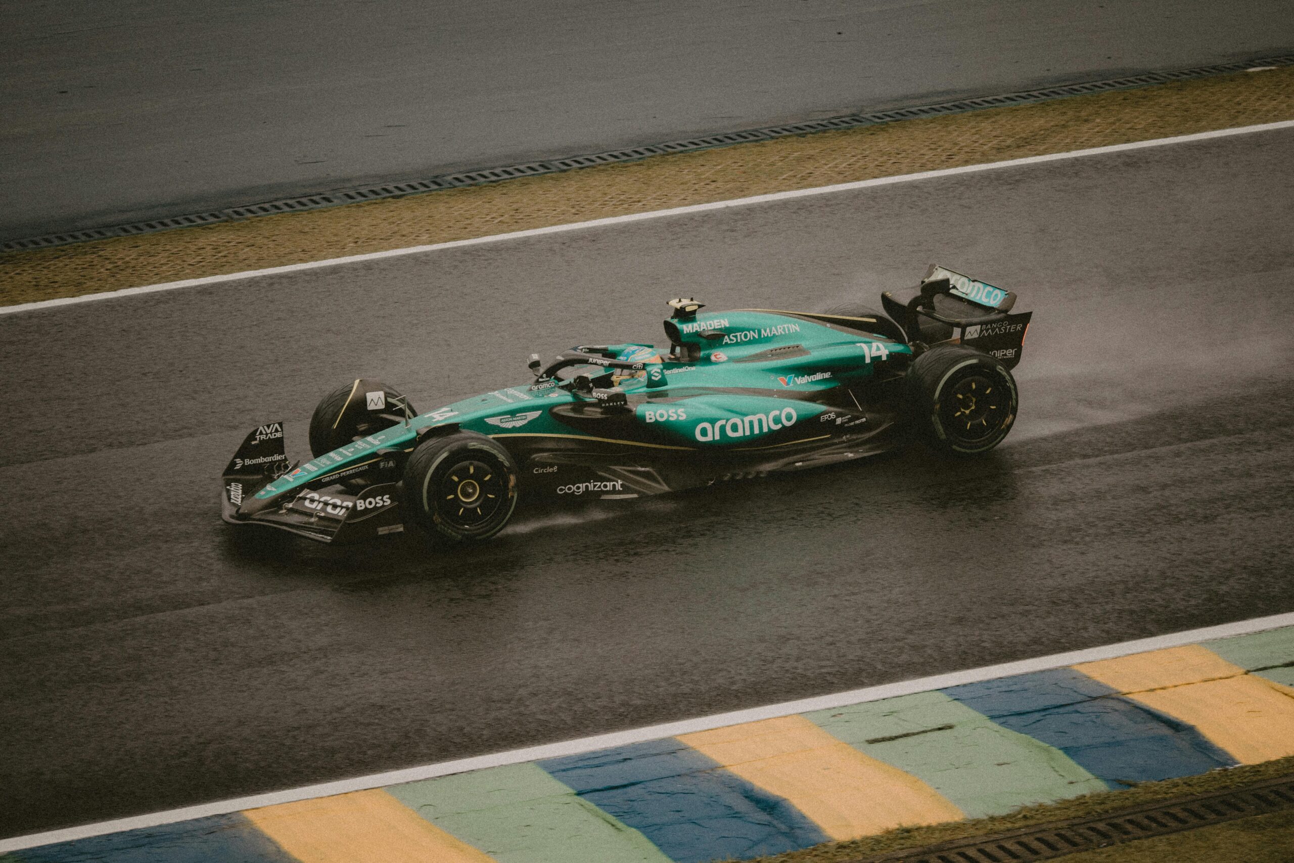A Formula 1 car racing on a rain-soaked track, showcasing speed and precision.